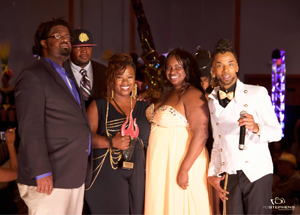 Winner of Hair Competition Vela Davis with host Dizzie Ramsey and owners Kathy Blaze Jefferson & Terrance Hudson